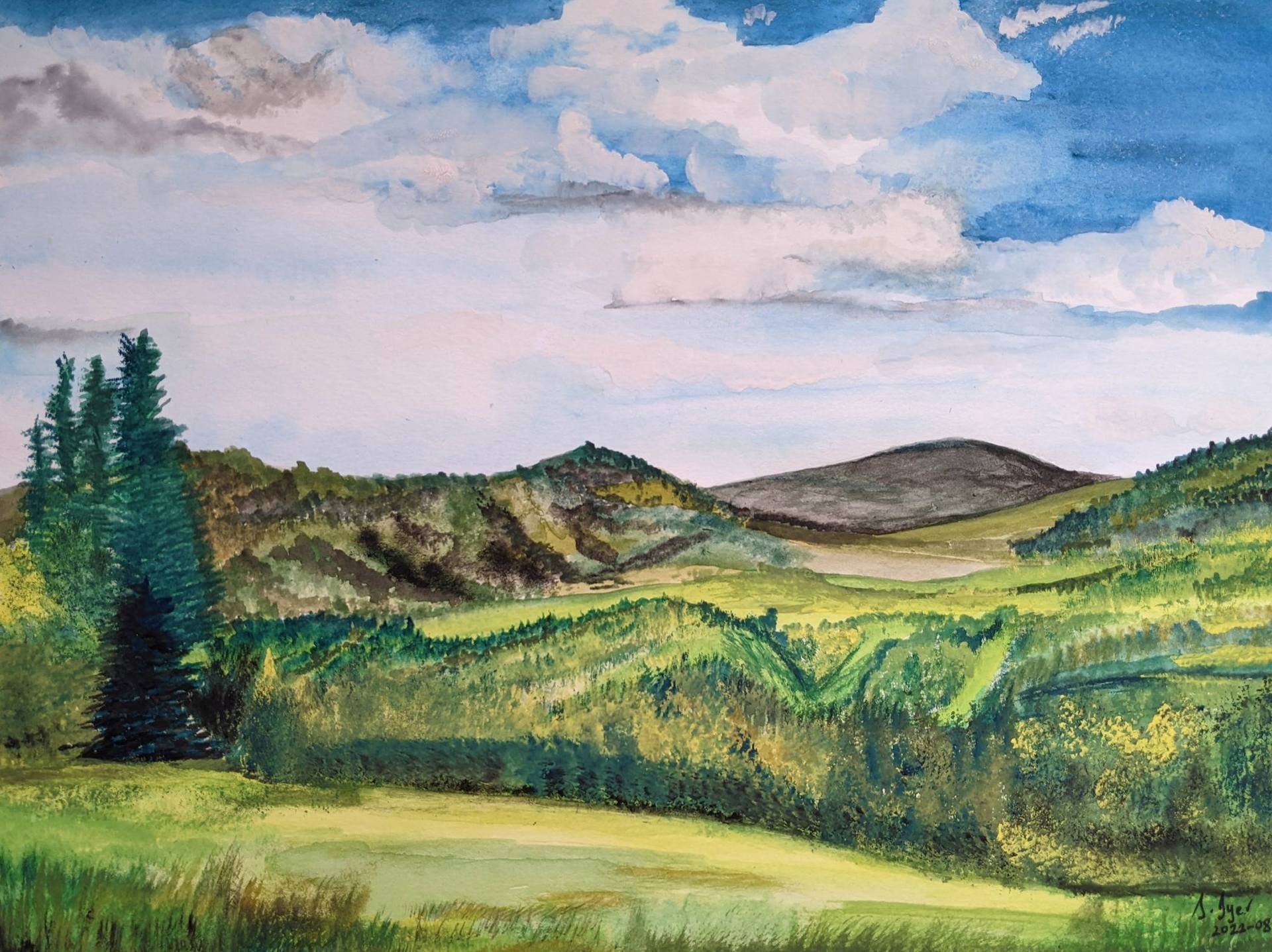 Hills, trees and clouds